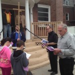 Pamela Krizek Tony Sculley and Fr. Bill Scafidi lead St. Mary's Parishioners in Praying the Stations in front of Living in Jesus Ministry with Rev. Hubbard